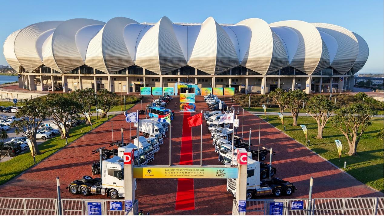 Commercial vehicles are displayed outside Nelson Mandela Bay Stadium during the automotive partnership gathering in Gqeberha, South Africa, October 28, 2026. /BAIC FOTON International